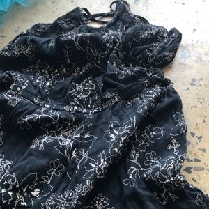 Black jumpsuit with white flowers